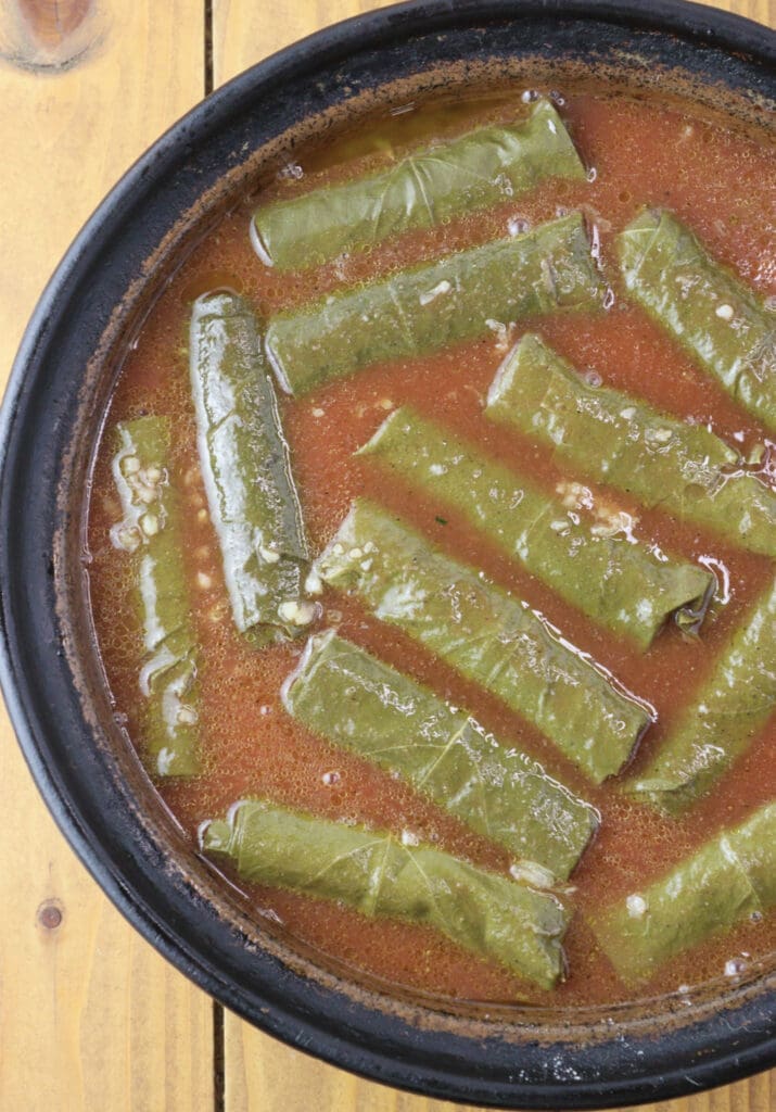 Japrak covered with tomato sauce before baking in the oven.